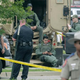Law-enforcement officials sit at the scene of a motorcyle gang shootout at theTwin Peaks restaurant in Waco, Texas, May 18, 2015. The shootout between rival biker gangs began the afternoon of May 17 and resulted in nine people being killed, many injured and 170 arrested.
Erich Schlegel/Getty Images